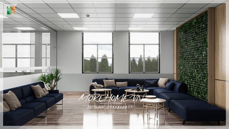 Sofa sẫm màu với phong cách thiết kế hiện đại làm nổi bật và tạo cảm giác thân thiện khi bước vào giờ làm việc.